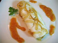 Bacalao con tomate y cebolla confitada
