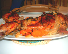 Conejo asado con mandarinas