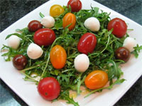 Ensalada de rúcula y remix de tomates