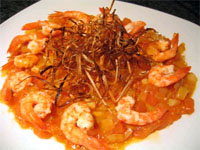 Langostinos con concassé de tomate