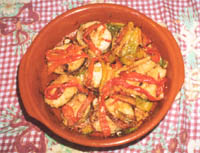 Merluza a la Bilbaína con pimientos rojos.
