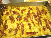 Patatas al horno con jamón en tiras 