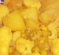 Patatas con guisantes al curry