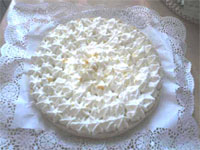 Tarta de cítricos con nata merengada.