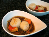 Vieiras sobre ceps en su salsa